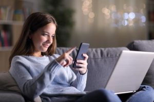girl on phone learning about social media and teen mental health