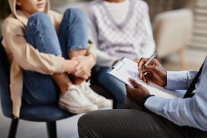 Teen and loved ones in family therapy for teens