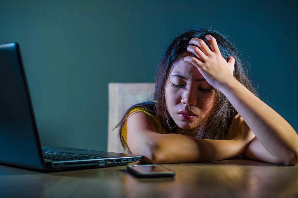 Person pondering the social media effects on teen stress