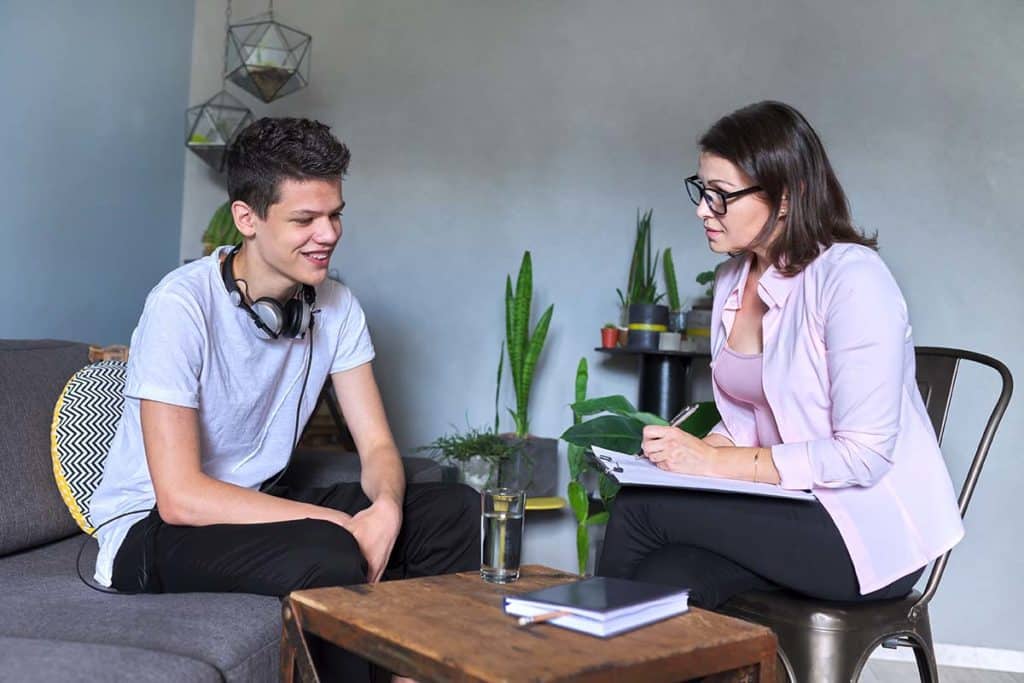 Two people discussing interpersonal therapy techniques