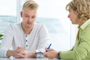 Two people talking about the benefits of cognitive-behavioral therapy for teens