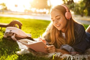 Teen learning that listening to music can help your mental health