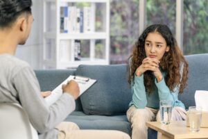 Teen talking to their therapist about how interpersonal therapy can help with depression